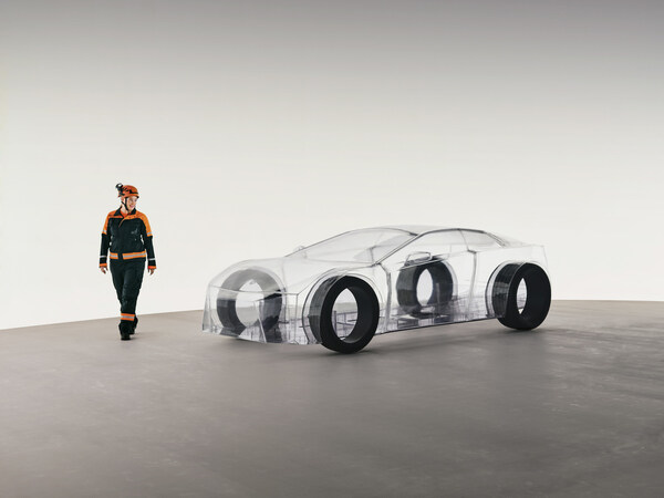 A dedicated Sandvik engineer walks around the eNimon, assessing the eNimon, which highlights the critical, often unseen, reliance on robust mining infrastructure to power the EV future.